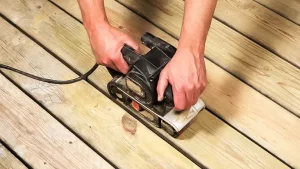 Sanding a wood deck